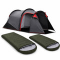 Studio product shot of a complete camping kit against a plain white background, featuring a grey and red 2-person tunnel tent positioned behind two individual green sleeping bags.