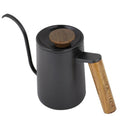 Black coffee pot with wooden handle and lid knob on a white background