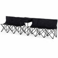 Set of black collapsible outdoor benches with a built-in central table and backs, isolated on a white background.
