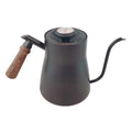 Black gooseneck kettle with wooden handle on a white background