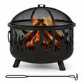 Black metal fire pit with a mesh spark cover, burning wood inside, and a metal fire poker placed in front on a white background
