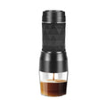 Black portable coffee maker with glass container on a white background