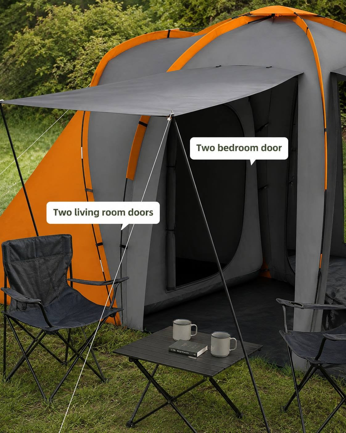 Close-up view of the entrance of a camping tent showing the zipped doors leading into the two separate bedrooms and the central living area.