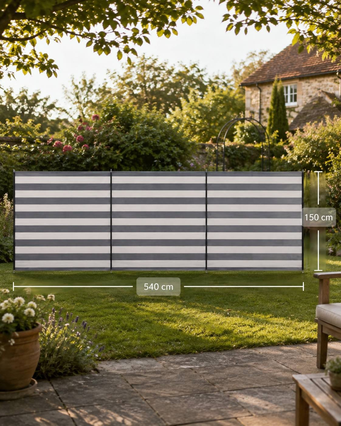 Grey-and-white striped camping windbreak set up on a lawn with dimension indicators showing a length of 540 cm and a height of 150 cm.