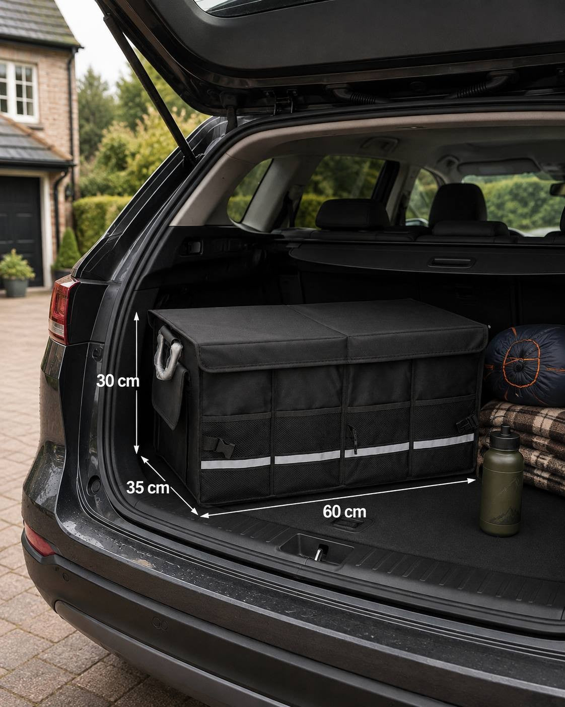 A black collapsible car trunk organiser positioned inside the boot of a dark SUV, with dimension overlays indicating 60 cm length, 35 cm width, and 30 cm height, next to packed camping gear.