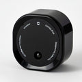 Black cylindrical product with branding on a white background