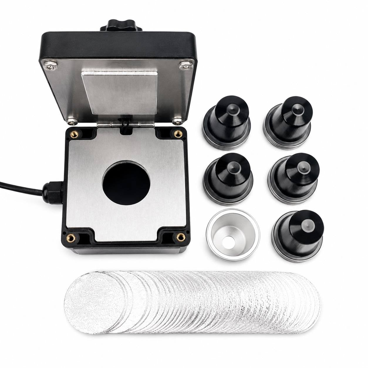 Electric coffee capsule sealing tool set featuring black refillable capsules and foil stickers for home use.