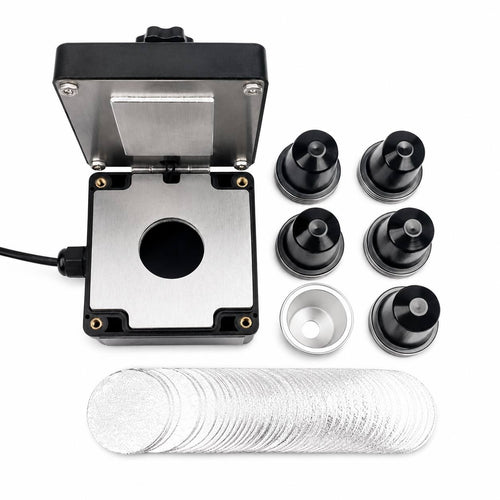 Electric coffee capsule sealing tool set featuring black refillable capsules and foil stickers for home use.