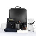 Coffee dripper kettle and grinder travel kit.