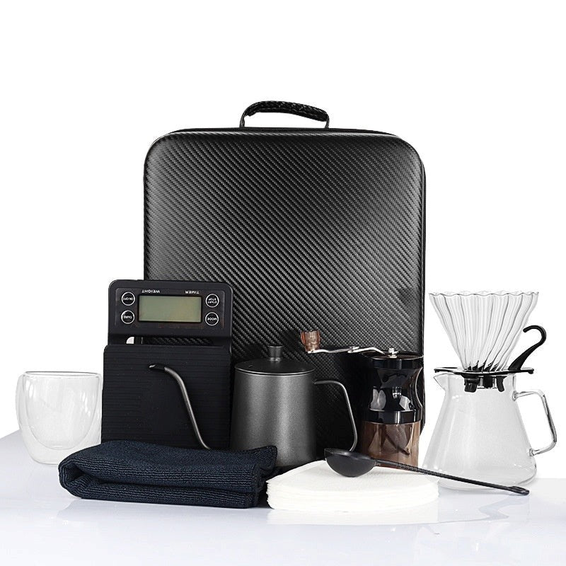 Coffee dripper kettle and grinder travel kit.