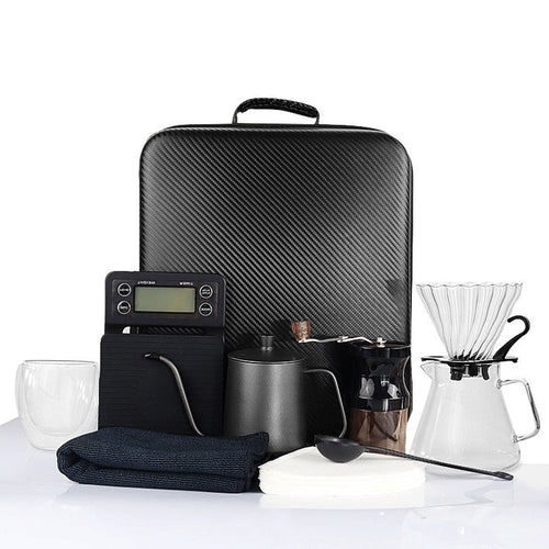 Coffee dripper kettle and grinder travel kit.