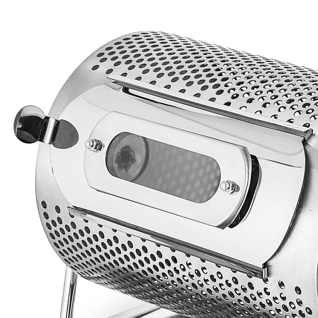 Detailed view of the coffee roaster base and stainless steel cooling tray, showing the robust assembly.