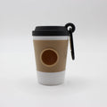 Reusable coffee cup with a black lid and handle on a white background