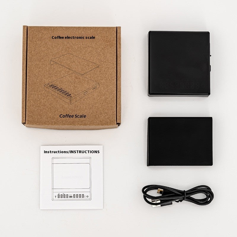 Coffee electronic scale with packaging, instructions, and cable on a white background