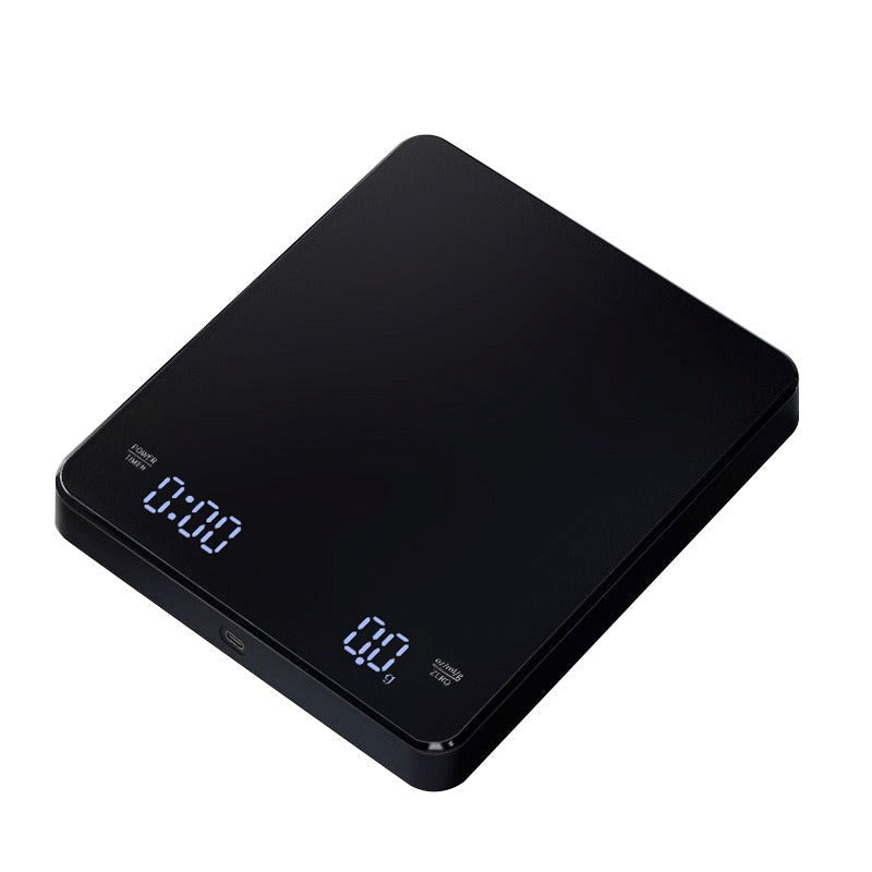 Black digital kitchen scale on a white background