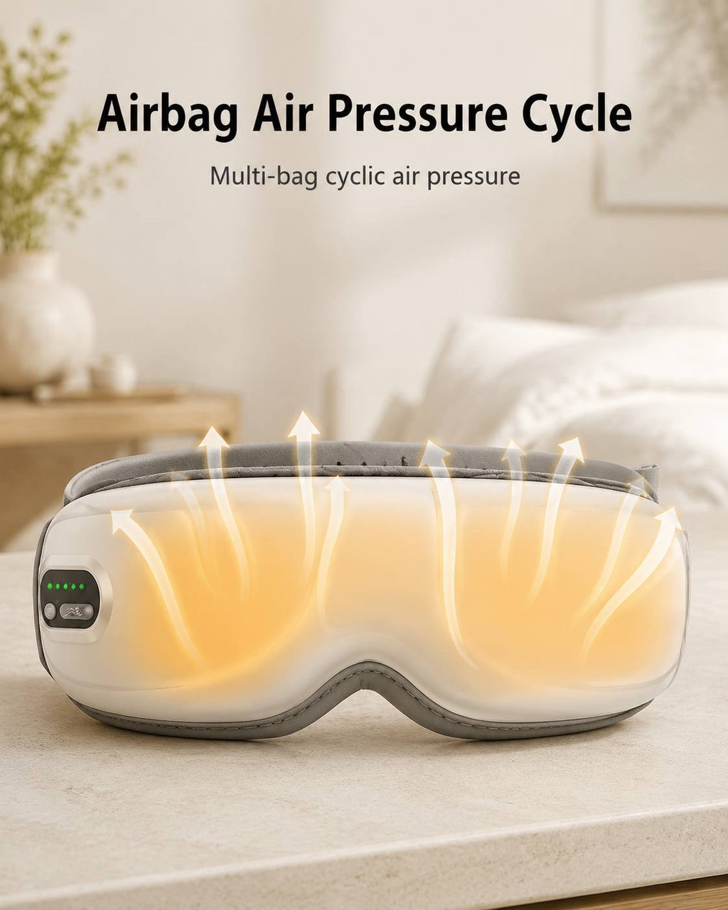A white electric airbag eye massager resting on a light surface with graphic air pressure upward arrows illustrating the multi-bag cyclic air pressure massage function.