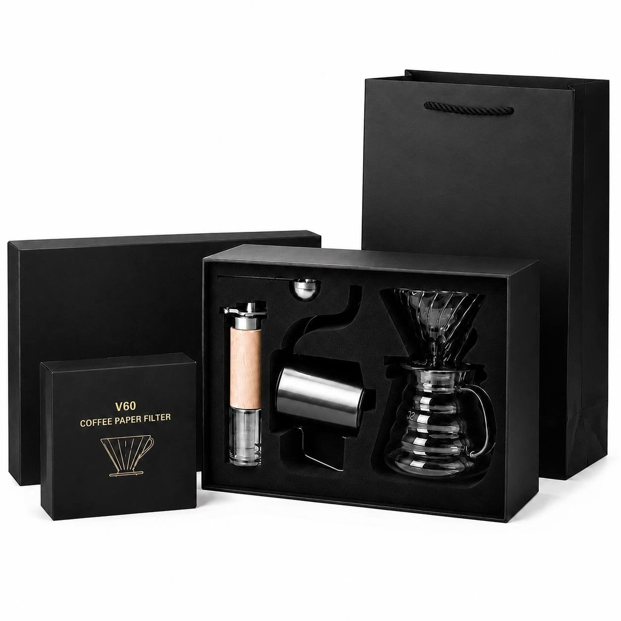 A complete coffee brewing kit including a box of filters, a dripper, a grinder, a kettle, and a gift bag on a white background.