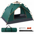 A green automatic camping tent presented alongside its matching carrying bag, metal ground stakes, wind ropes, and replacement poles on a neutral background.