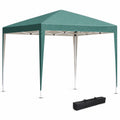 Green pop-up gazebo with a metal frame and canopy, accompanied by a black carry bag, isolated on a white background.