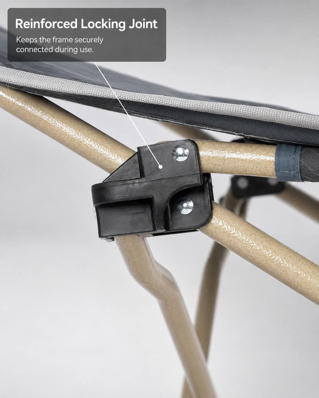 Close-up view of the reinforced black plastic locking joint connecting the metal frame tubes of a camping cot.