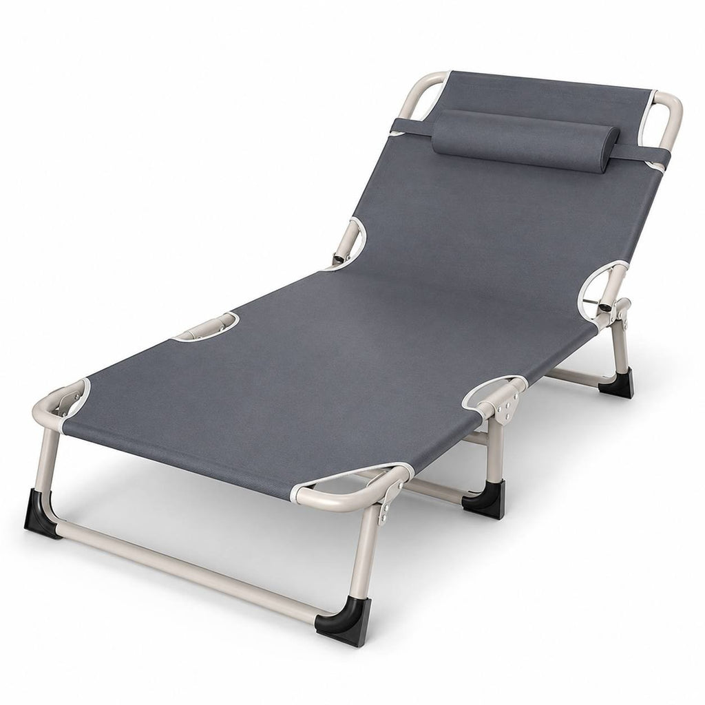 A grey folding sun lounger with a matching headrest pillow and sturdy metal frame, presented isolated on a clean white background.