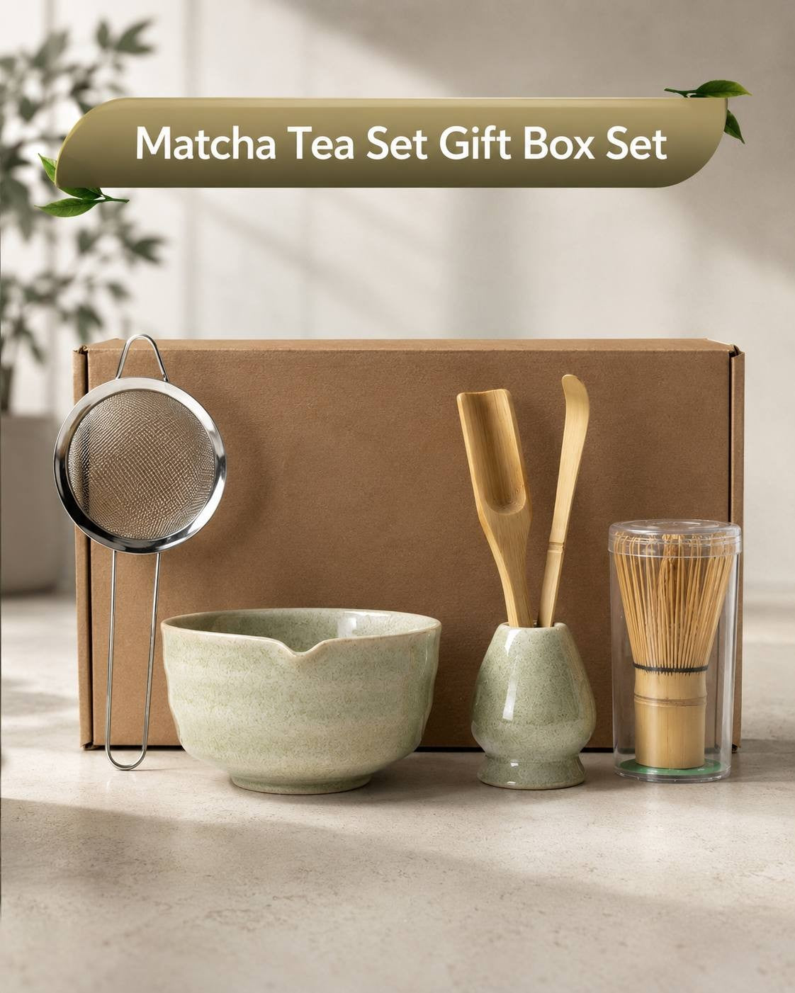 Green ceramic matcha tea bowl, bamboo whisk set, scoop, and fine mesh strainer inside a presentation box.