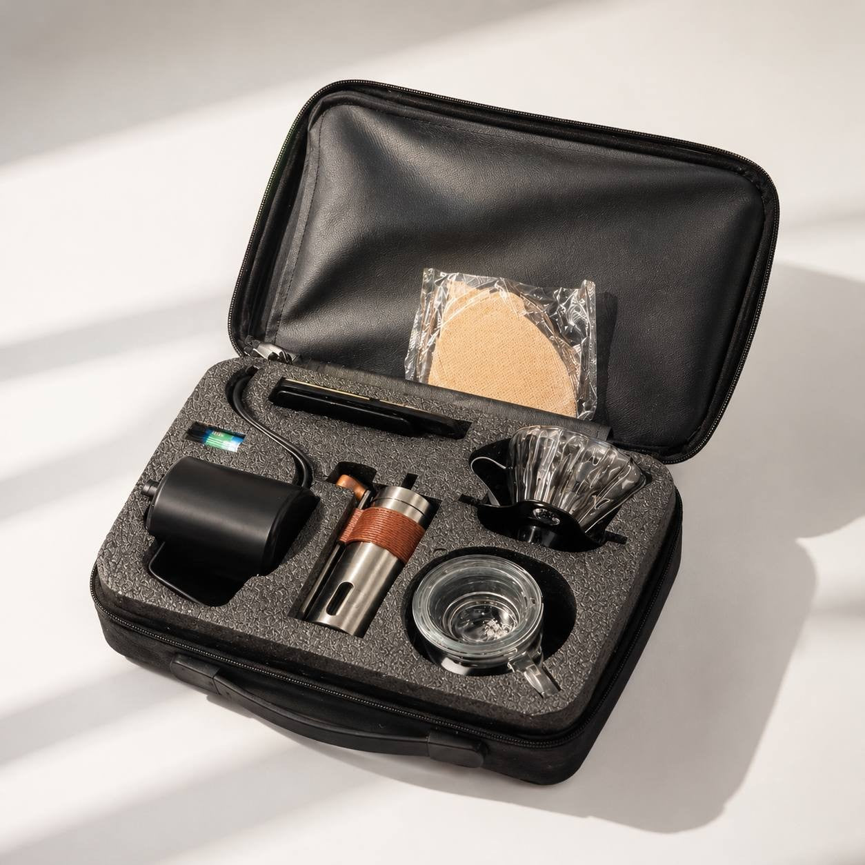 Portable 5 piece manual coffee-brewing kit travel case.