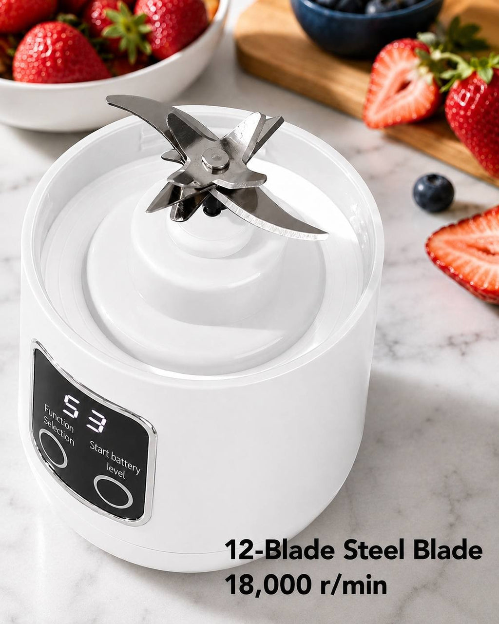 Close-up view of the 12-blade stainless steel cutting mechanism inside the base of a white portable cordless blender operating at 18,000 r/min next to fresh strawberries and blueberries.