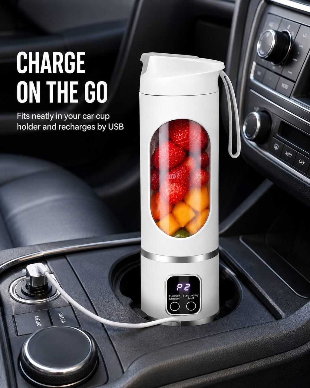 white portable cordless blender placed inside a car cup holder while connected to a USB car charger, featuring strawberries and mango chunks inside the blending cup.
