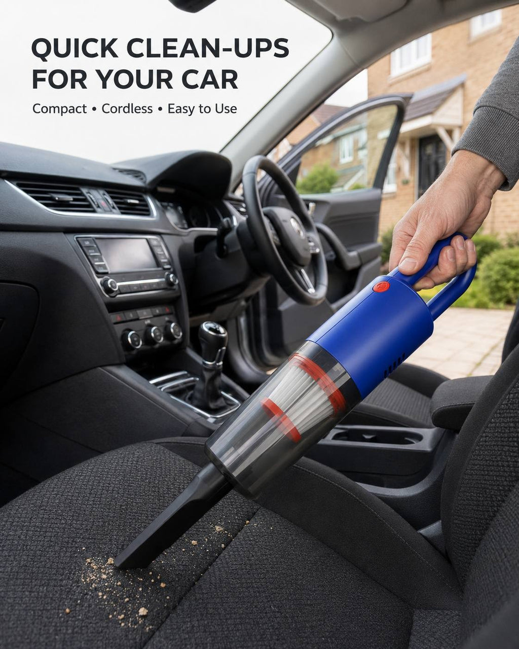 A person using a blue compact cordless handheld vacuum cleaner to vacuum debris and crumbs off the front passenger seat of a car.
