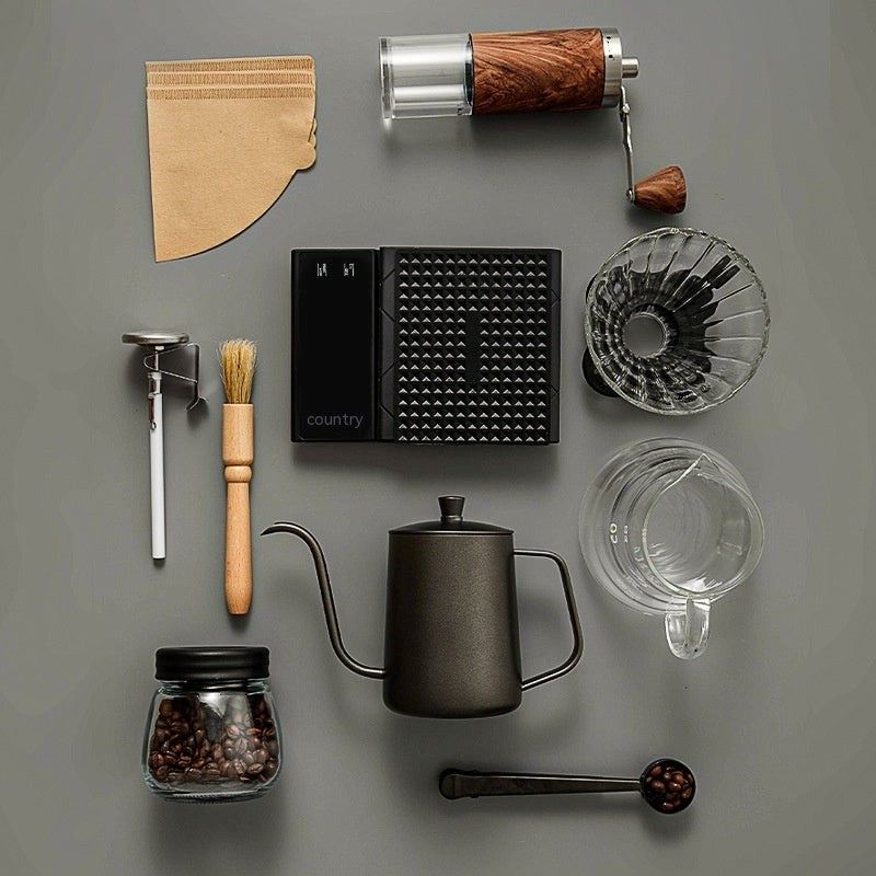 Collection of coffee-making tools on a gray surface