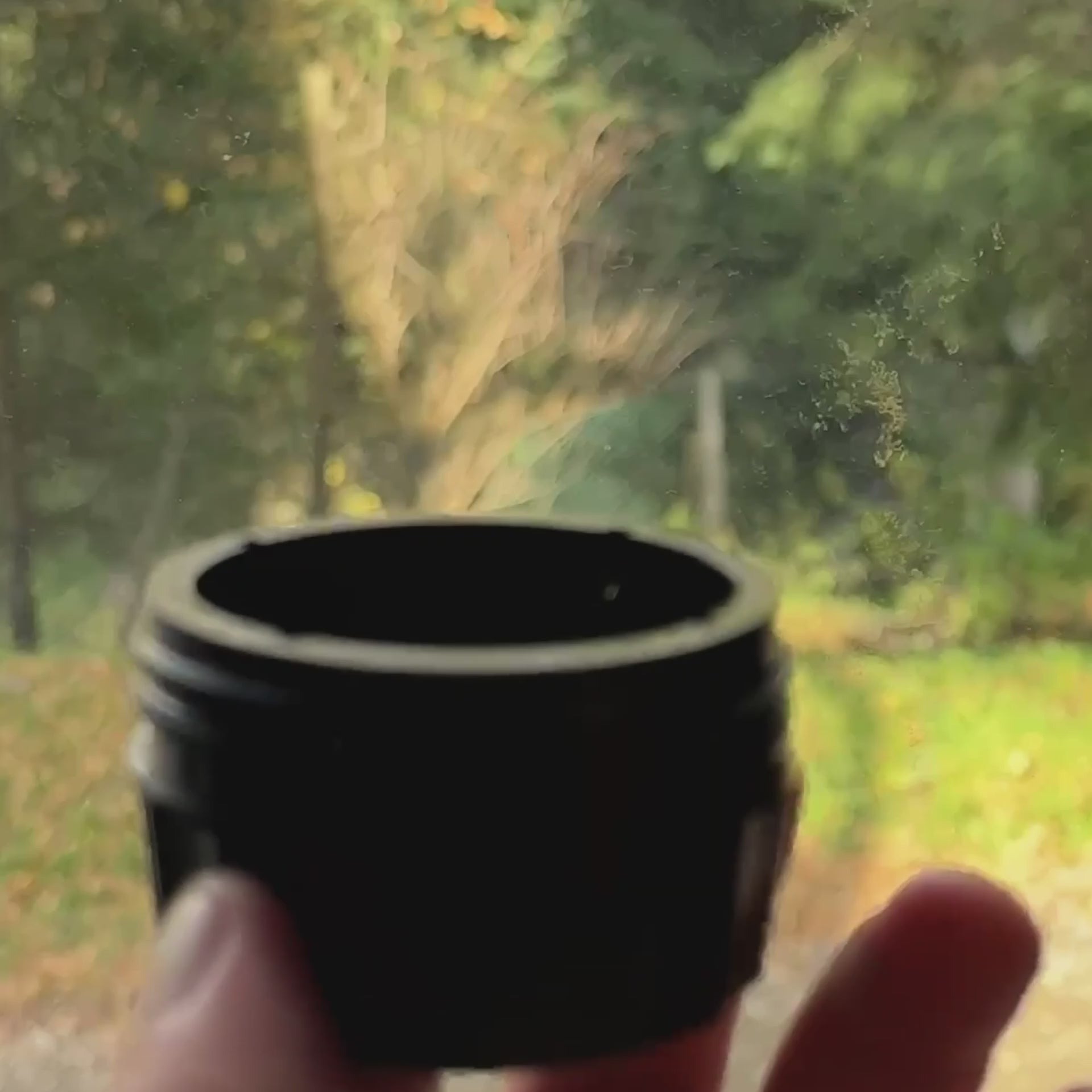  Portable coffee maker brewing rich espresso from a capsule after a double button press.