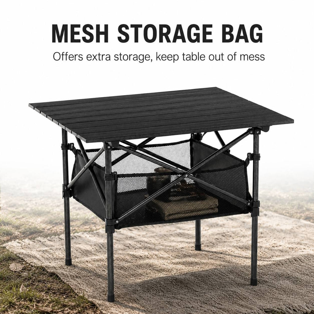 Promotional graphic with the headline "MESH STORAGE BAG" showing a black folding camping table with kitchen gear stored in the net shelf, set outdoors on a fabric mat.
