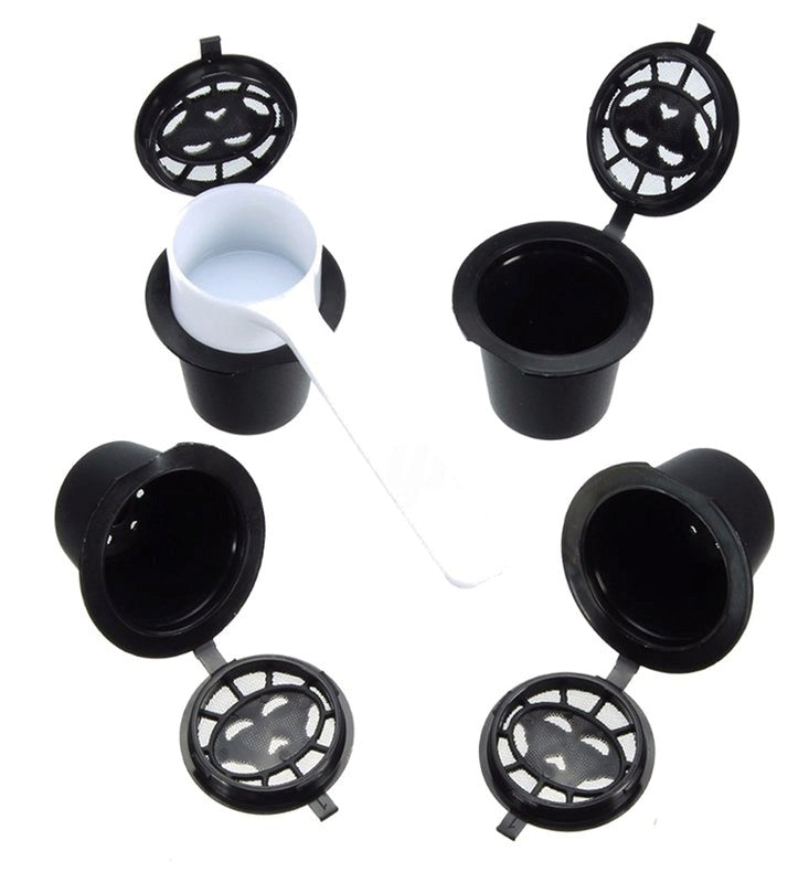 Set of black coffee filters with a white measuring cup on a white background