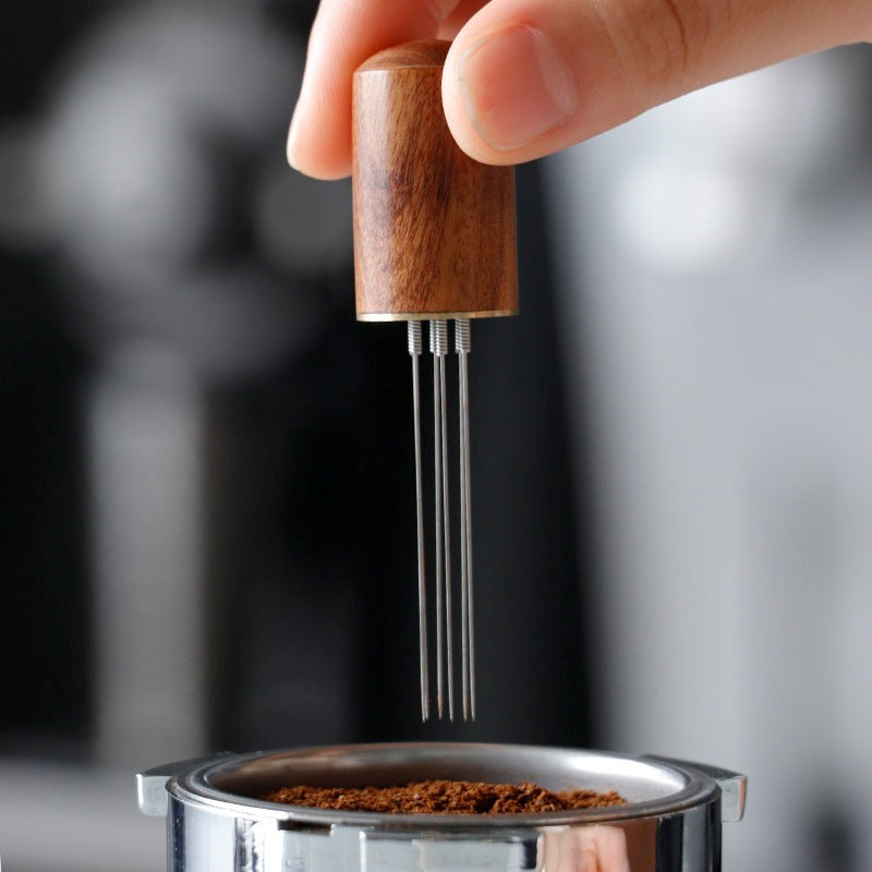 tool-espresso-needle-distributor-stirring-ground-coffee-in-portafilter