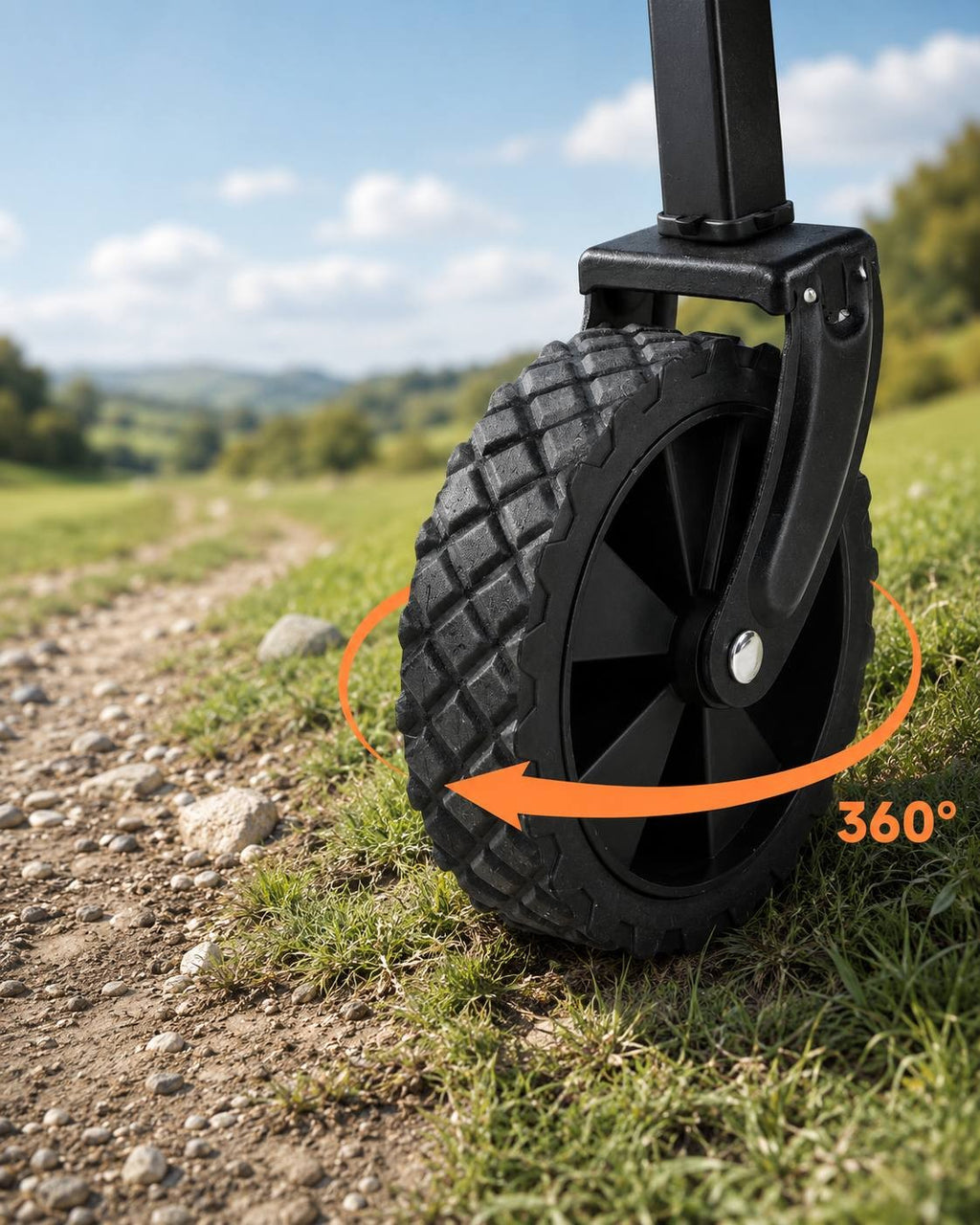Close-up of a rugged, textured rubber wheel on a utility cart, featuring an orange curved arrow and text indicating a 360-degree rotation capability on a gravel path.